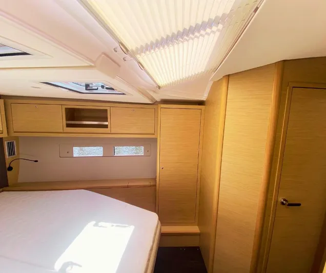 Dufour 530 In Annapolis Yacht Photos Pics 2024 Dufour 530 yacht interior cabin with wooden finish and natural light.