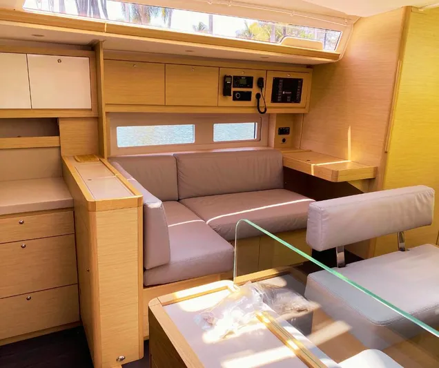 Dufour 530 In Annapolis Yacht Photos Pics Modern interior of 2024 Dufour 530 yacht with light wood finish and comfortable seating.