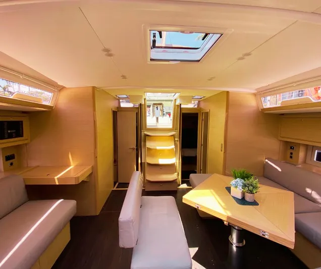 Dufour 530 In Annapolis Yacht Photos Pics Interior of 2024 Dufour 530 yacht with modern furnishings and natural light.