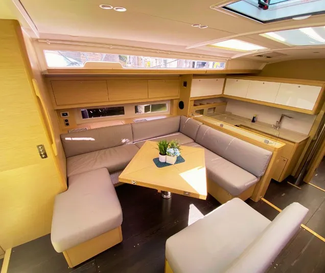 Dufour 530 In Annapolis Yacht Photos Pics Modern interior of 2024 Dufour 530 yacht with spacious seating and dining area.