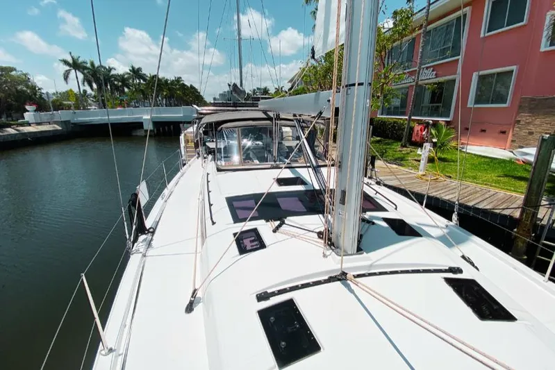 Dufour 530 In Annapolis Yacht Photos Pics 2024 Dufour 530 sailboat docked near waterfront homes.