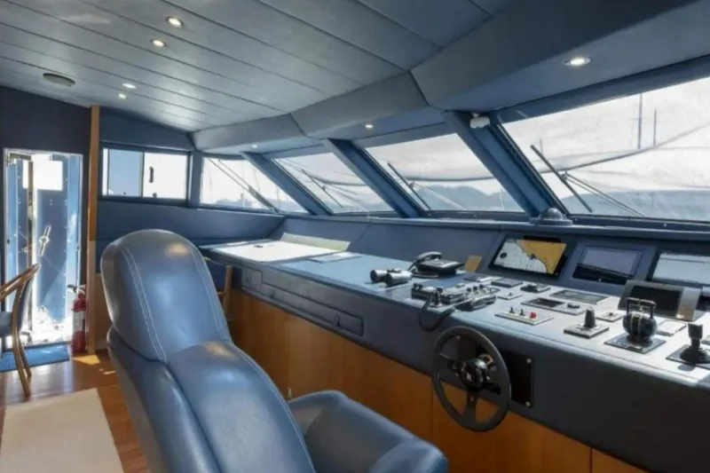  Yacht Photos Pics Luxurious 1995 Codecasa 24 yacht cockpit with modern navigation equipment and leather seating.