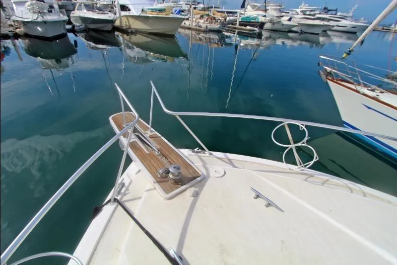  Yacht Photos Pics Bow view of 1994 Bertram 50 Convertible yacht docked in a marina.