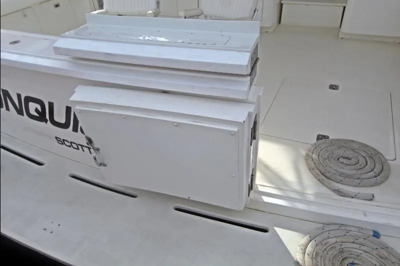  Yacht Photos Pics 1994 Bertram 50 Convertible yacht deck with storage compartment and coiled rope.