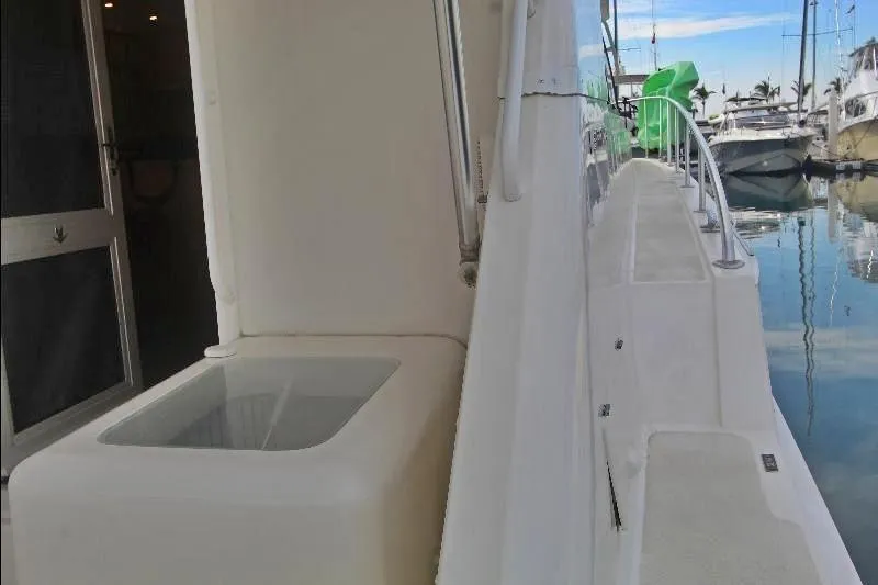  Yacht Photos Pics 1994 Bertram 50 Convertible yacht deck view at marina, showcasing sleek design and spacious layout.