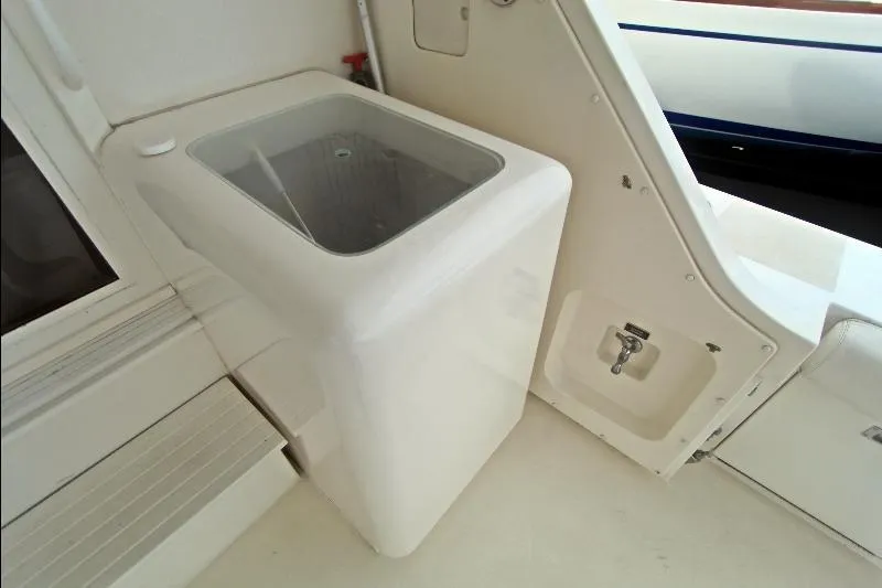  Yacht Photos Pics 1994 Bertram 50 Convertible yacht interior with built-in storage compartment.