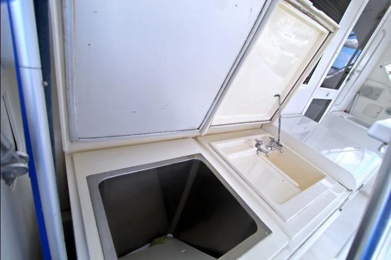 Yacht Photos Pics 1994 Bertram 50 Convertible yacht sink and storage area.