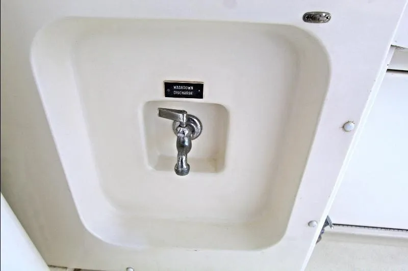  Yacht Photos Pics Washdown discharge faucet on 1994 Bertram 50 Convertible boat.