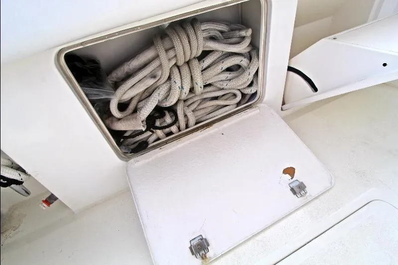  Yacht Photos Pics Storage compartment with coiled ropes on a 1994 Bertram 50 Convertible boat.