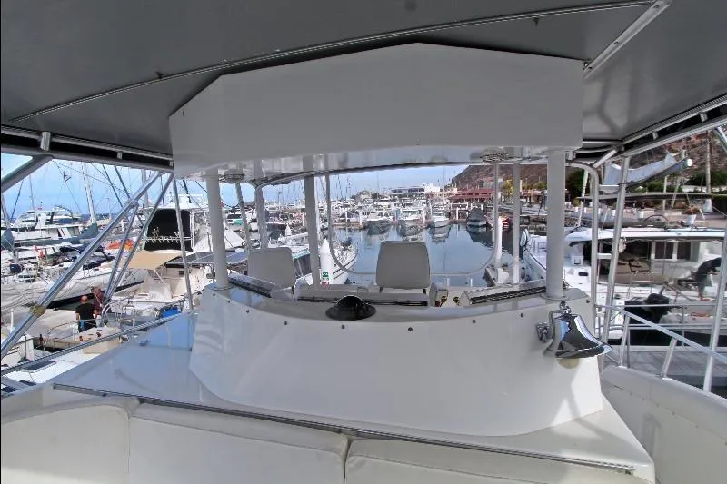  Yacht Photos Pics 1994 Bertram 50 Convertible yacht helm with marina view.