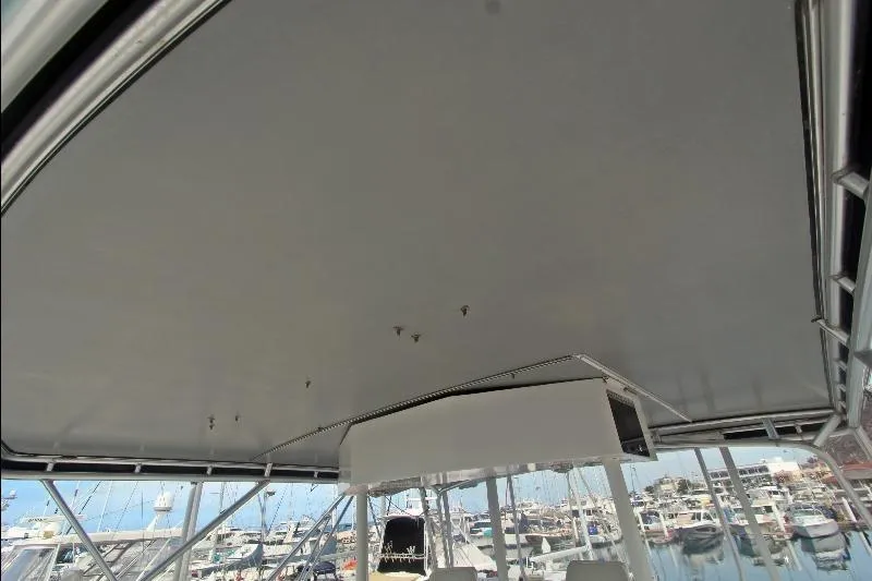  Yacht Photos Pics 1994 Bertram 50 Convertible boat interior with marina view in the background.