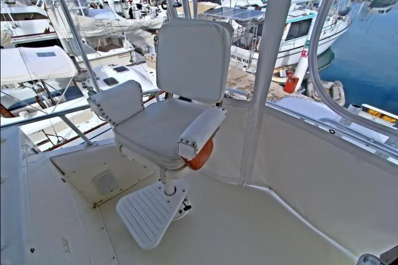  Yacht Photos Pics Captain's chair on 1994 Bertram 50 Convertible yacht, docked at marina.