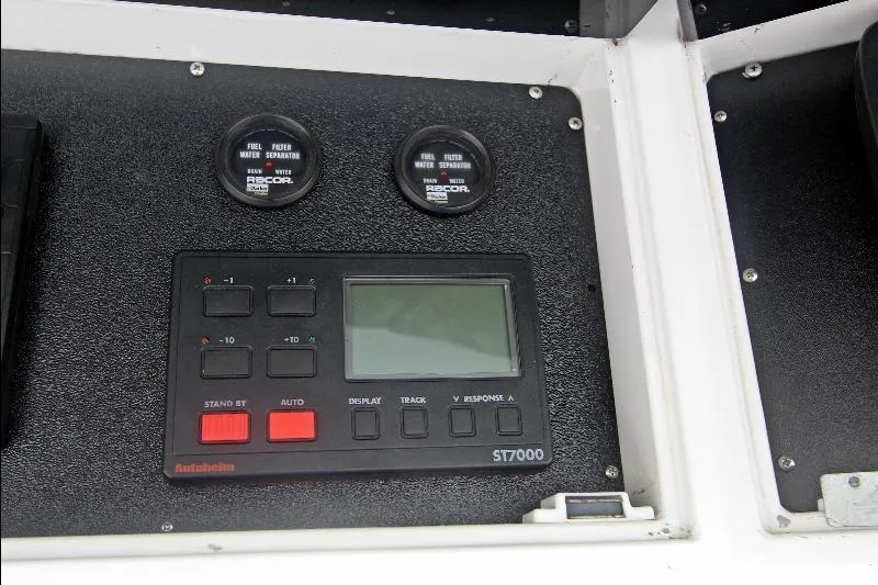  Yacht Photos Pics Control panel of a 1994 Bertram 50 Convertible boat with gauges and display.