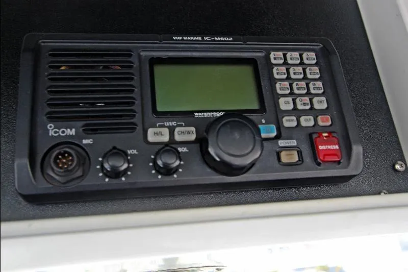  Yacht Photos Pics ICOM VHF Marine IC-M602 radio on 1994 Bertram 50 Convertible boat dashboard.