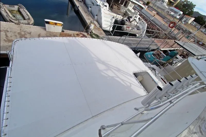  Yacht Photos Pics 1994 Bertram 50 Convertible yacht docked at marina, top view.