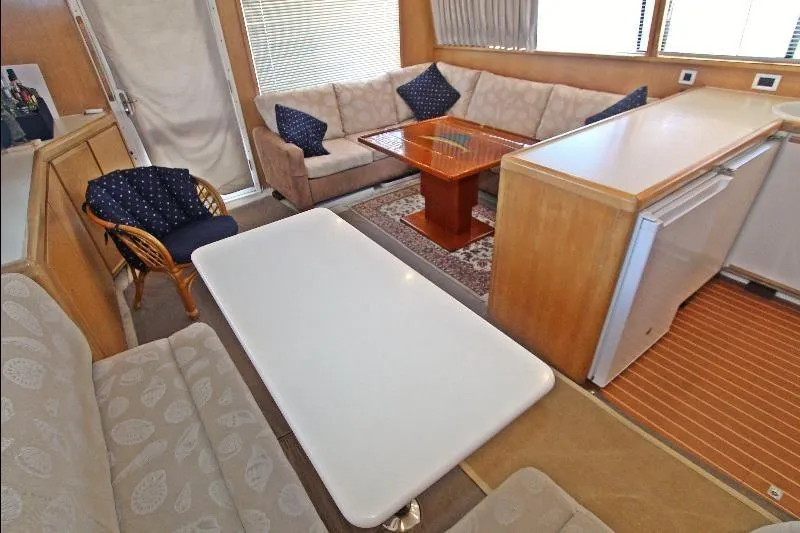  Yacht Photos Pics Interior of a 1994 Bertram 50 Convertible yacht with cozy seating and modern amenities.
