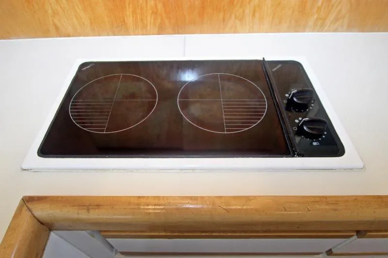  Yacht Photos Pics Stovetop in 1994 Bertram 50 Convertible yacht kitchen area.