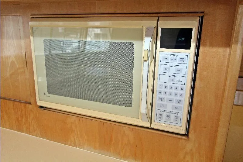  Yacht Photos Pics Built-in microwave in a 1994 Bertram 50 Convertible yacht kitchen.