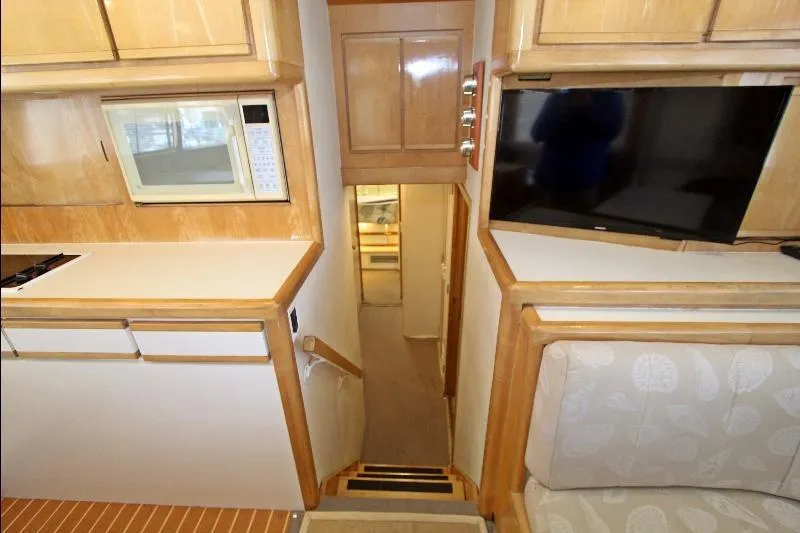  Yacht Photos Pics Interior of 1994 Bertram 50 Convertible yacht with kitchen and seating area.