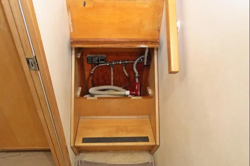  Yacht Photos Pics 1994 Bertram 50 Convertible interior showing plumbing and storage compartment.