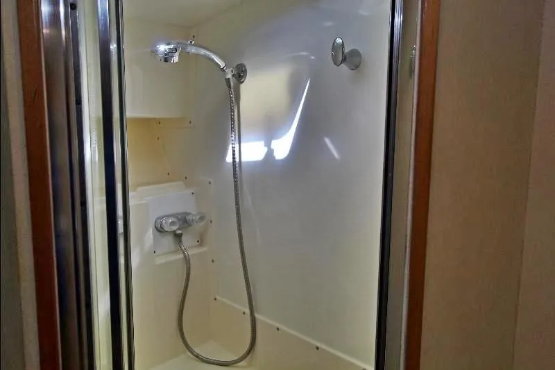  Yacht Photos Pics Shower area in 1994 Bertram 50 Convertible yacht, featuring modern fixtures.