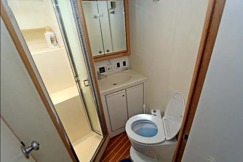 Yacht Photos Pics Bathroom interior of 1994 Bertram 50 Convertible yacht with shower and toilet.