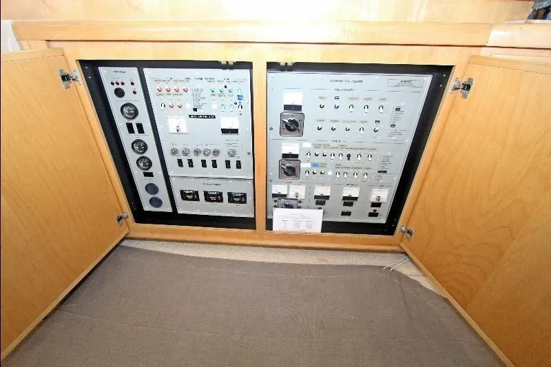  Yacht Photos Pics Electrical control panel inside a 1994 Bertram 50 Convertible yacht, featuring various switches and gauges.