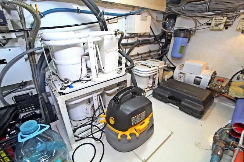  Yacht Photos Pics Engine room of a 1994 Bertram 50 Convertible yacht with equipment and wiring.