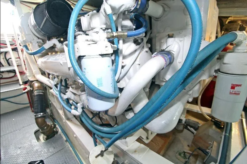  Yacht Photos Pics Engine room of a 1994 Bertram 50 Convertible with visible hoses and components.