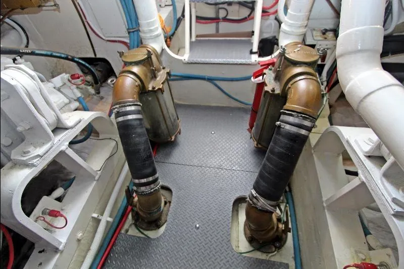  Yacht Photos Pics Engine room of a 1994 Bertram 50 Convertible yacht, showing mechanical components and piping.