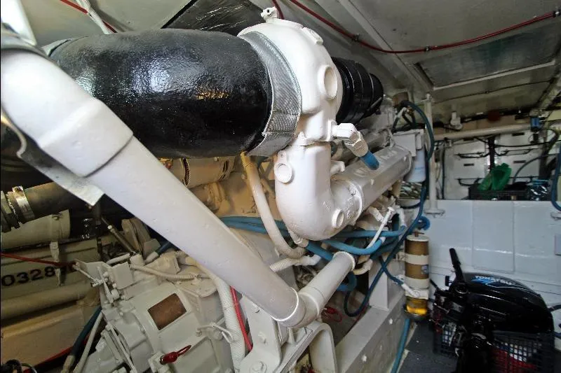  Yacht Photos Pics Engine room of a 1994 Bertram 50 Convertible yacht, showcasing mechanical components.