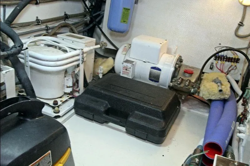  Yacht Photos Pics Engine room of a 1994 Bertram 50 Convertible yacht, showcasing mechanical components.