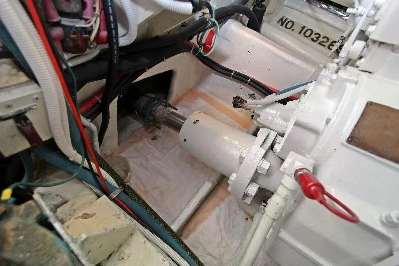  Yacht Photos Pics Engine room of a 1994 Bertram 50 Convertible boat, showcasing mechanical components and wiring.