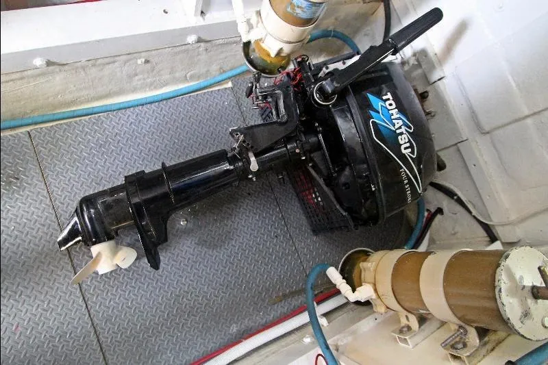  Yacht Photos Pics Engine compartment of a 1994 Bertram 50 Convertible with Tohatsu outboard motor.