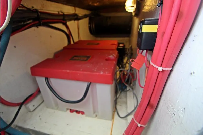  Yacht Photos Pics Battery compartment of 1994 Bertram 50 Convertible with red cables and lighting.