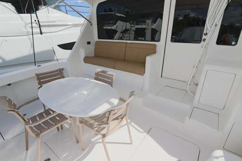 Juris Tantrum Yacht Photos Pics 2011 Viking 46 Convertible yacht deck with seating and table.