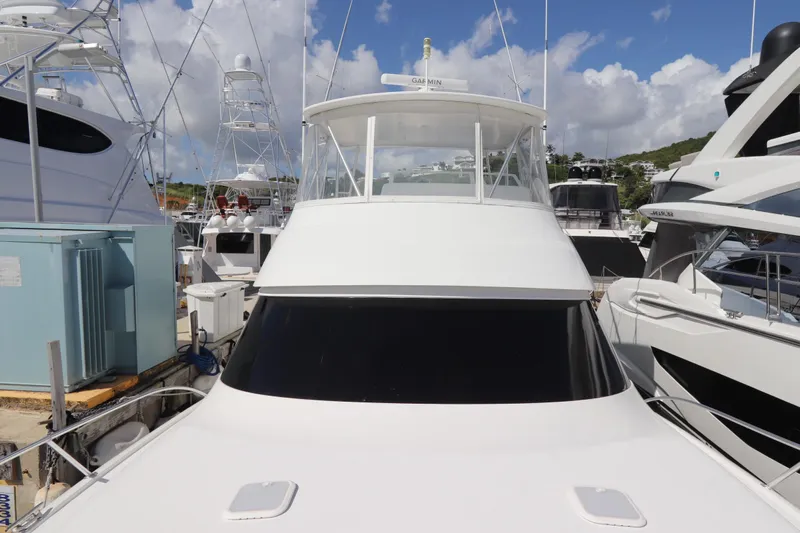 Juris Tantrum Yacht Photos Pics 2011 Viking 46 Convertible yacht docked at marina under blue sky.