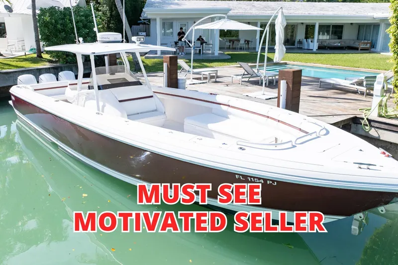  Yacht Photos Pics 2012 Intrepid 400 Center Console boat docked, labeled "Must See Motivated Seller."