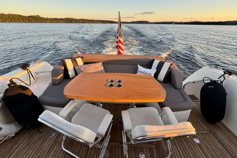 My Three Es Yacht Photos Pics Luxurious 2016 Prestige 500 S yacht deck with seating, table, and scenic water view.