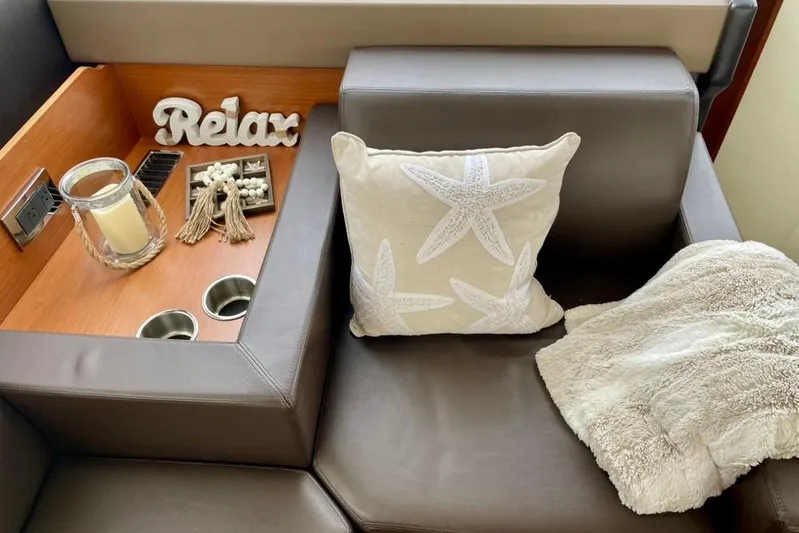 My Three Es Yacht Photos Pics Luxurious seating area on 2016 Prestige 500 S yacht with starfish pillow and cozy decor.