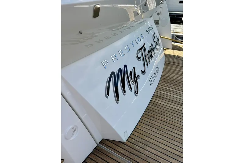 My Three Es Yacht Photos Pics 2016 Prestige 500 S yacht with "My Three G's" name, docked on wooden deck.