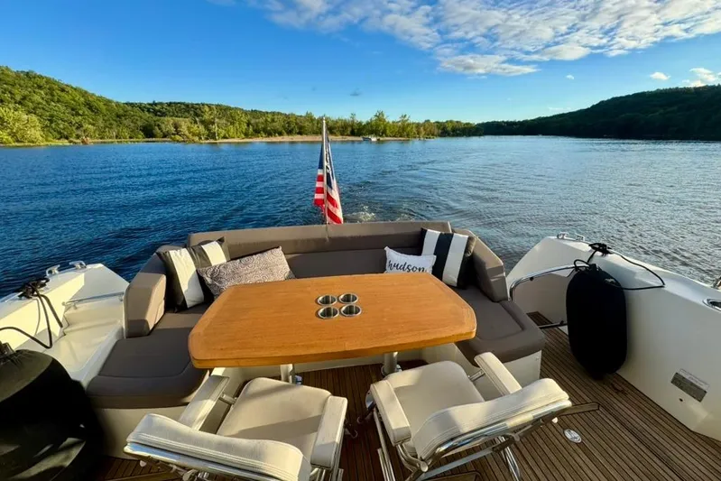 My Three Es Yacht Photos Pics Luxury 2016 Prestige 500 S yacht with elegant seating, cruising on a serene lake.