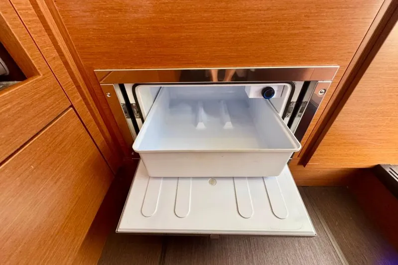 My Three Es Yacht Photos Pics Built-in drawer on 2016 Prestige 500 S yacht, featuring sleek wood paneling.