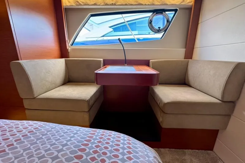 My Three Es Yacht Photos Pics Interior of 2016 Prestige 500 S yacht with cozy seating and window view.