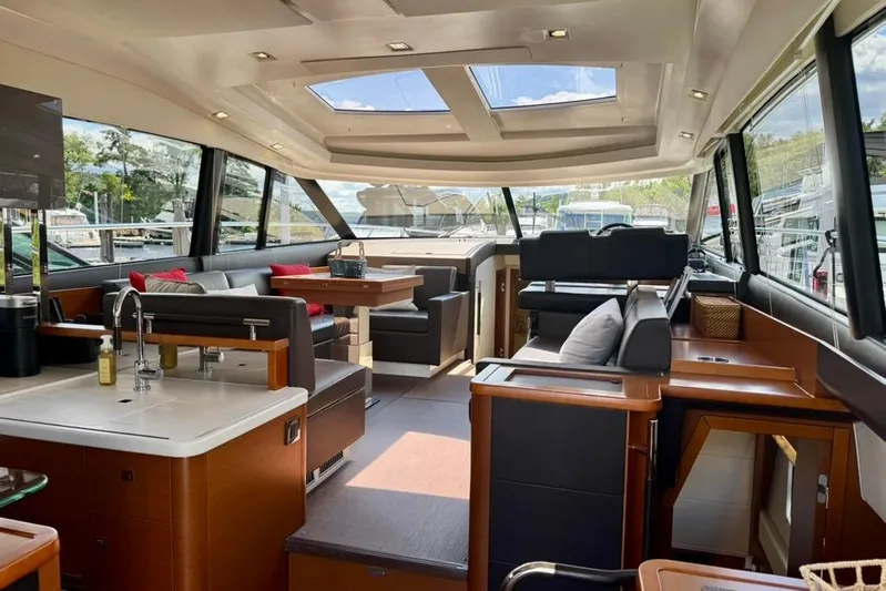 My Three Es Yacht Photos Pics Luxurious interior of a 2016 Prestige 500 S yacht with modern furnishings and panoramic windows.