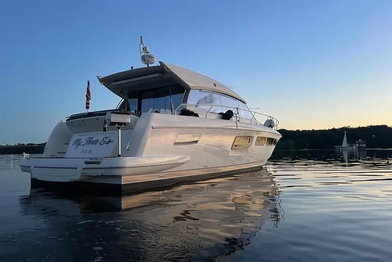 My Three Es Yacht Photos Pics 2016 Prestige 500 S yacht on calm water at sunset.
