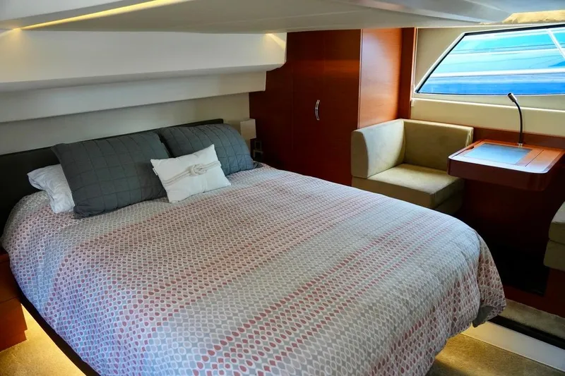 My Three Es Yacht Photos Pics Luxurious cabin interior of 2016 Prestige 500 S yacht with cozy bed and seating area.