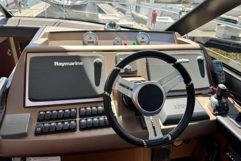 My Three Es Yacht Photos Pics Cockpit of 2016 Prestige 500 S yacht with Raymarine navigation system and Volvo Penta controls.