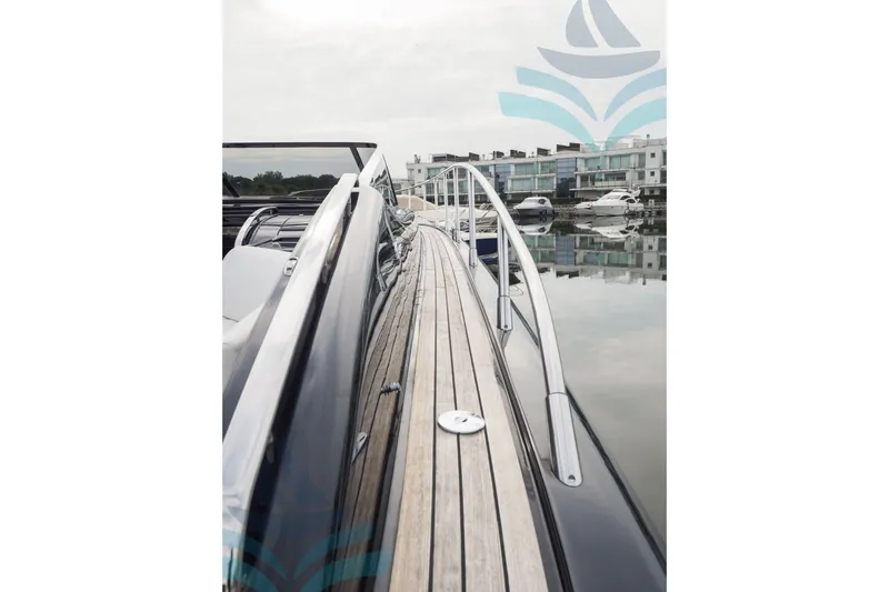  Yacht Photos Pics 2016 Riva 52 Rivale yacht docked, showcasing sleek design and luxurious deck.