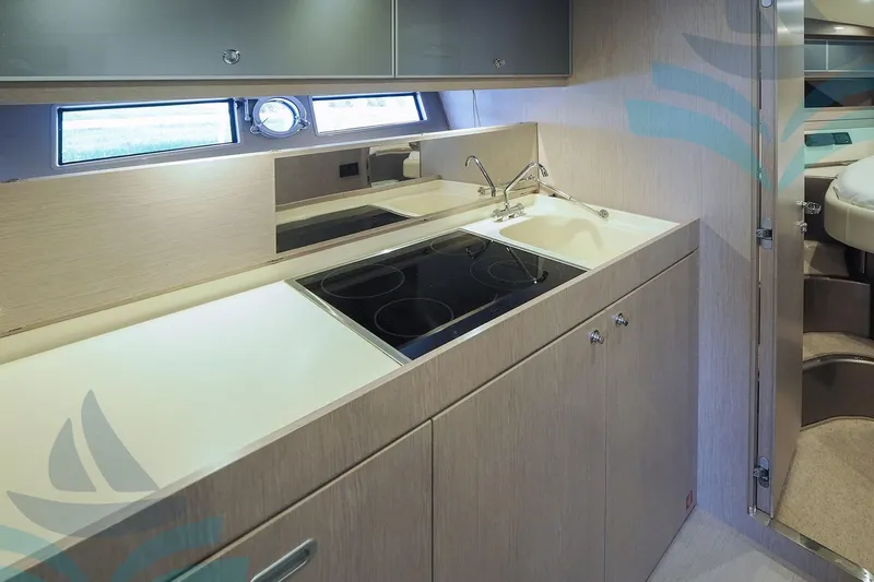  Yacht Photos Pics Modern kitchen interior of 2016 Riva 52 Rivale yacht with sleek design and appliances.